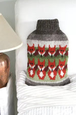 Load image into Gallery viewer, luscious scarves hotwater Pachamama Skulk of Foxes Hot Water Bottle , Hand Knitted , Fairtrade

