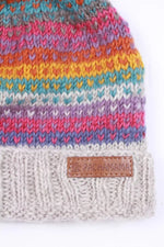 Load image into Gallery viewer, luscious scarves wool hat Pachamama Villarica Roll Back Bobble Hat , Handknitted , Fairtrade
