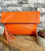 Load image into Gallery viewer, lusciousscarves Bright Orange Italian Leather Fold Over Clutch Bag with Tassel, Available in 17 Colours .

