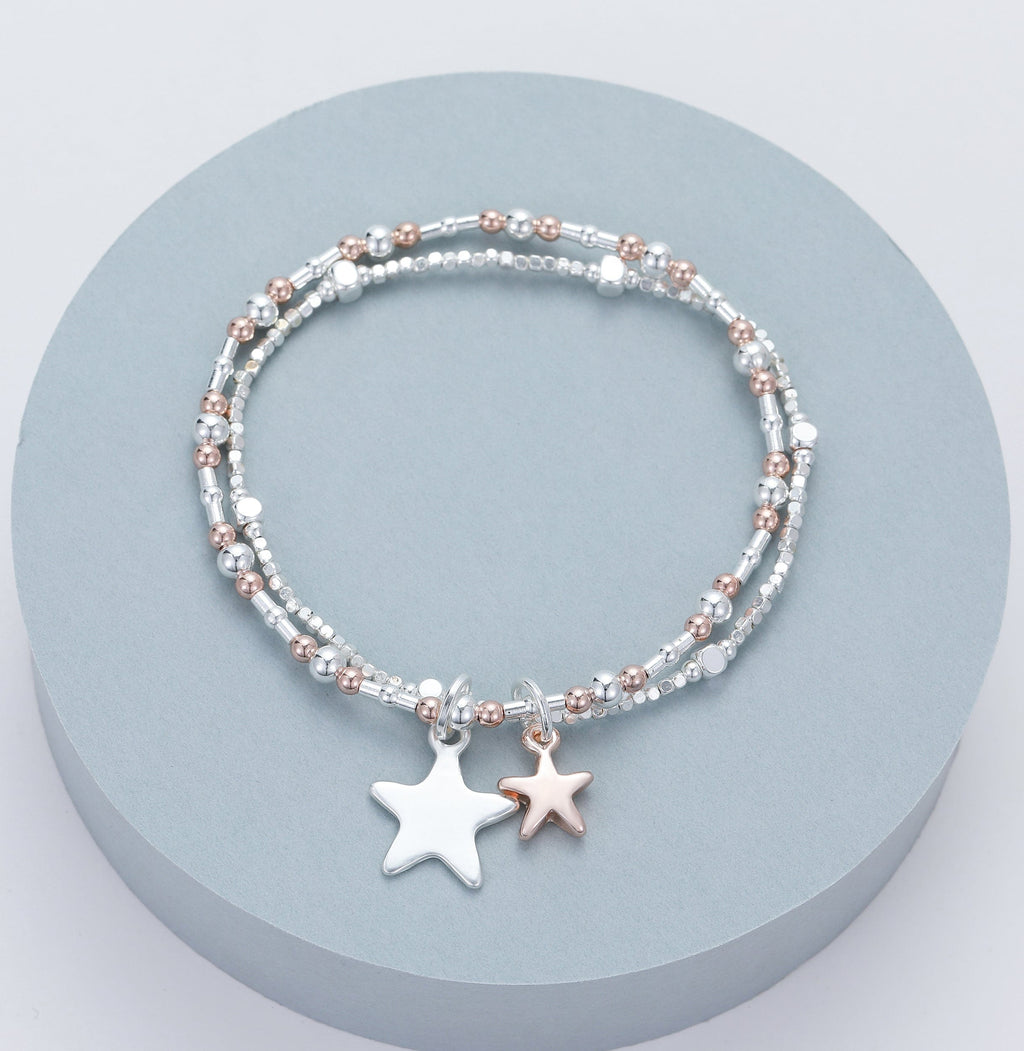 lusciousscarves Gracee Silver and Rose Gold Double Strand Stretchy Bracelet with 2 Star Charms .