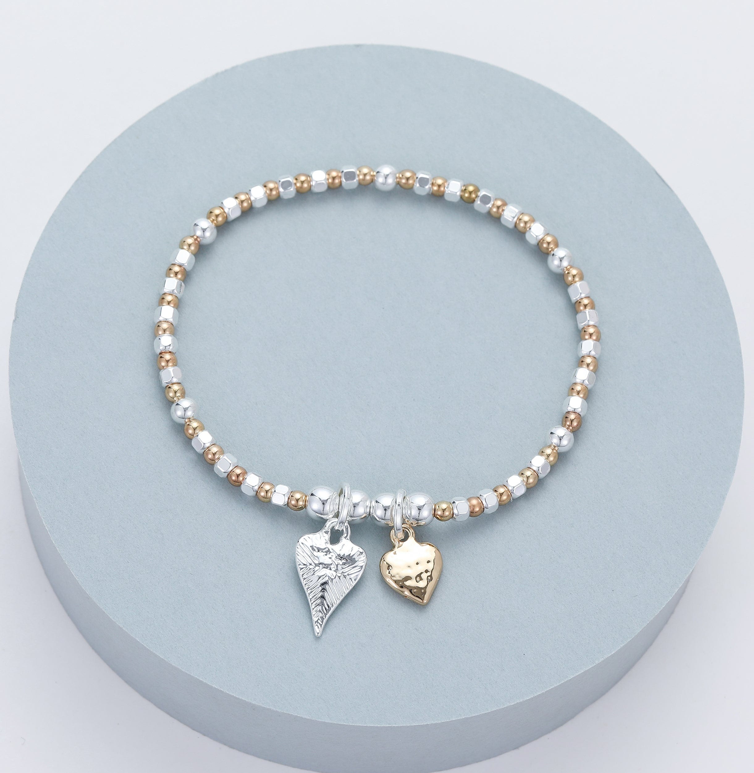lusciousscarves Gracee Stretchy Silver and Rose Gold Bracelet with 2 hammered Heart Charms