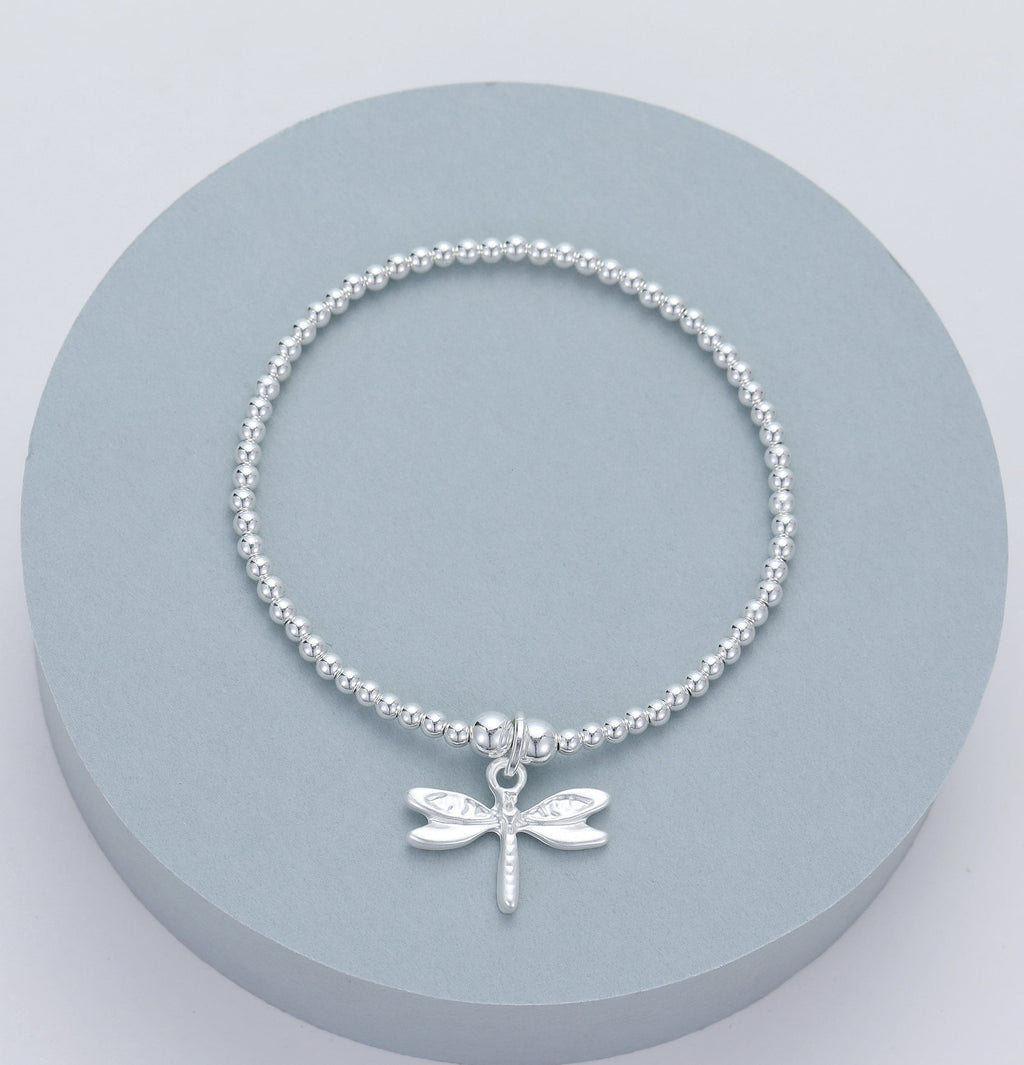 lusciousscarves Gracee Stretchy Silver Bracelet with a Small Dragonfly Charm.