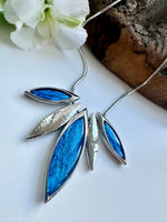 Load image into Gallery viewer, lusciousscarves Miss Milly Vibrant Blue and Silver Resin Leaf Necklace . FN551
