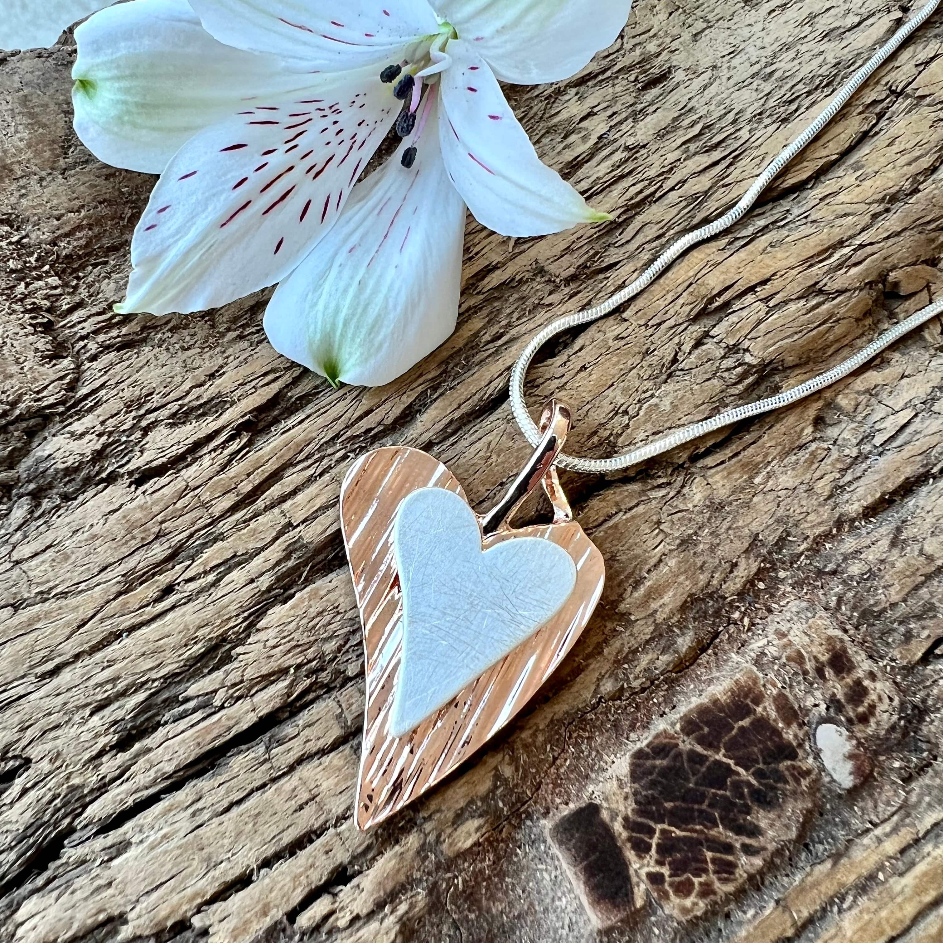 lusciousscarves Necklaces Silver and rose gold double hearts necklace.