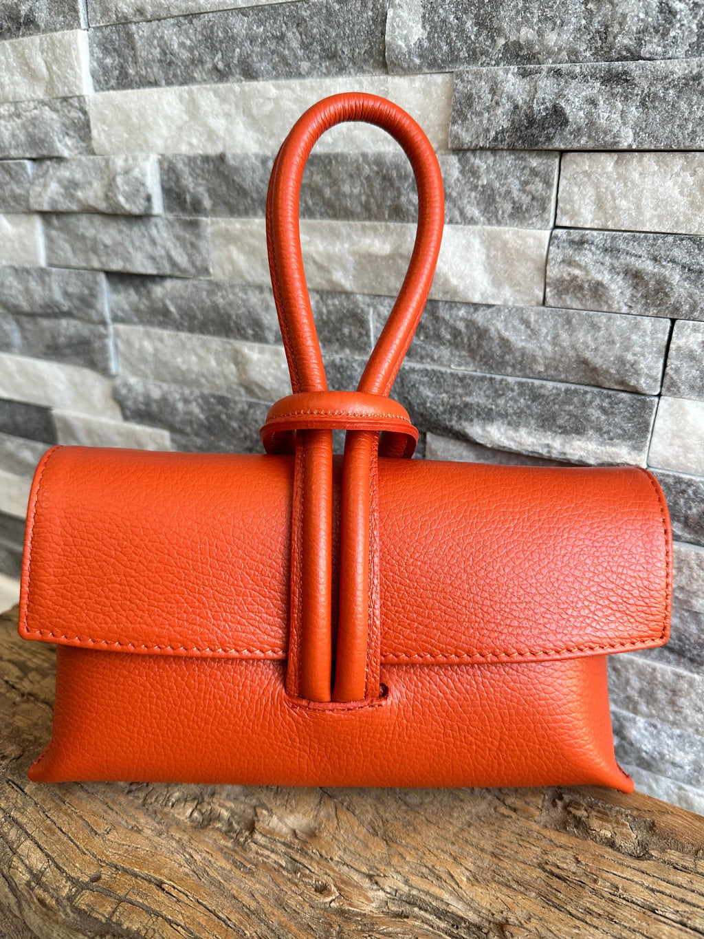 lusciousscarves Orange Italian Leather Clutch Bag with Loop Handle .