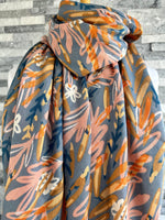 Load image into Gallery viewer, lusciousscarves Scarf Grey Scarf with Pale Pink. Tan, and Blue Water Coloured Leaves.
